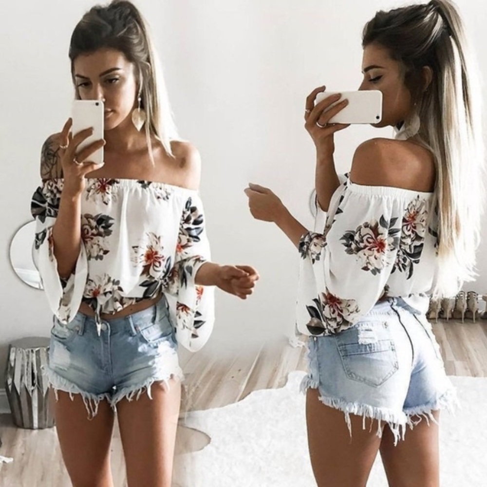 Woman’s floral shoulder blouse